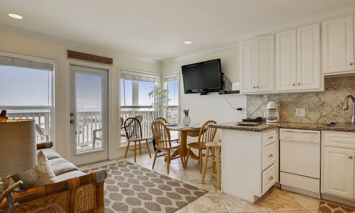Galveston Condo | Beach Cottage steps from Surf. fishing. the Beach and Serene Sunsets (1303)