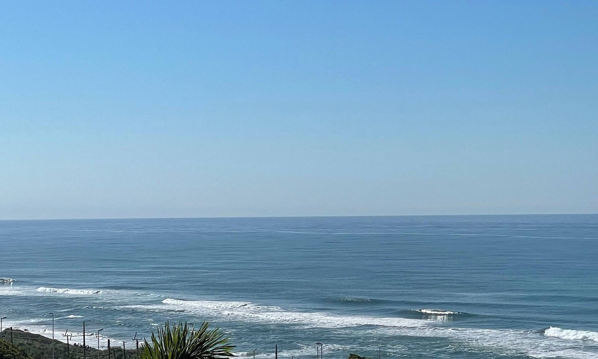 Warner Beach Cottage | Beautiful sea view from wooden balcony with sunrises to die for !