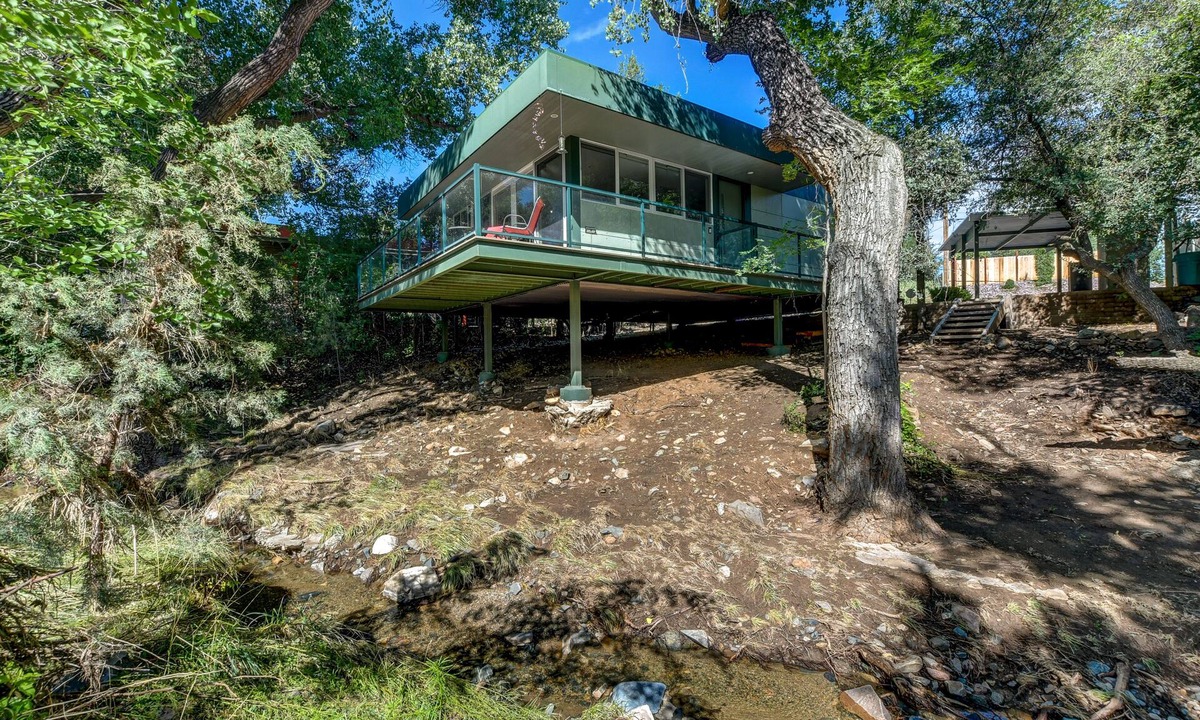 Diamond Valley Cabin | Modern cabin hidden among the trees- Unwind and relax on the porch creek-side.