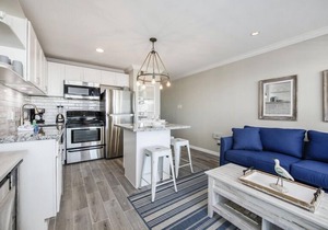 Trendy Beach Condo- Sunset views, Sandy Toes, Surfing more. (1304)