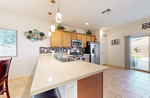 Buckeye House | Airy desert home with an enclosed yard, private pool, hot tub, firepit, & W/D