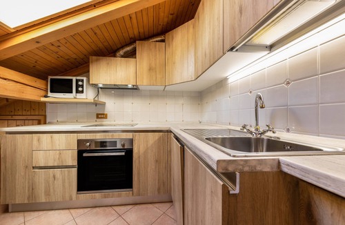 Vigo di Fassa Apartment | Apartment "Ciasa Sommavilla Mansarda" with Mountain View, Shared Garden & Wi-Fi
