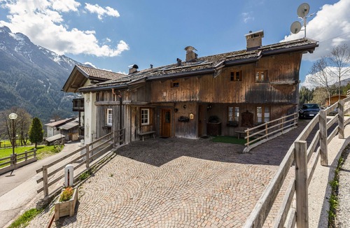 Vigo di Fassa Apartment | Apartment "Ciasa Sommavilla Mansarda" with Mountain View, Shared Garden & Wi-Fi
