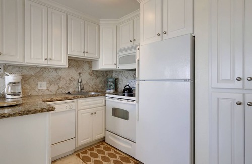 Galveston Condo | Beach Cottage steps from Surf. fishing. the Beach and Serene Sunsets (1303)