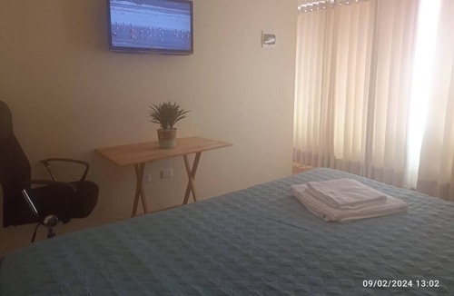 Puno House | Cozy room with TV and private bathroom