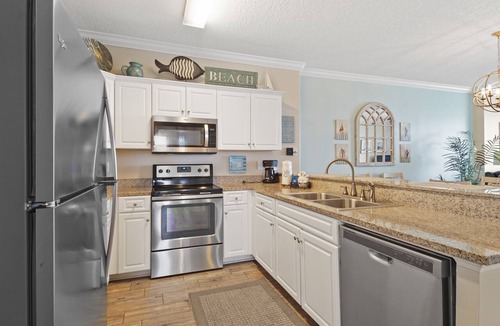 West Panama City Beach Condo | Emerald Isle 1401 - Front row beach chair service included! Affordable rates!