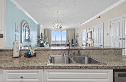 West Panama City Beach Condo | Emerald Isle 1401 - Front row beach chair service included! Affordable rates!