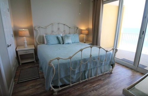 West Panama City Beach Condo | Emerald Isle 1006 - Front row beach chair service included! Affordable rates!