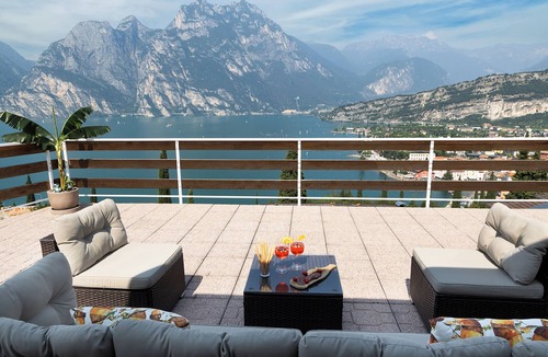 Torbole sul Garda Apartment | Exclusive residence in Torbole with breathtaking views, large terrace.