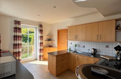 Kurtatsch an der Weinstraße House | Family apartment with playground and terrace surrounded by vineyards