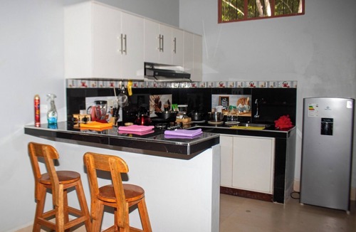 Sauce House | Family vacation home with a view of the forest and access to a small river.