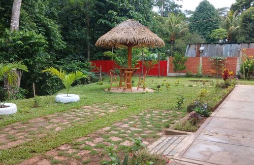 Sauce House | Family vacation home with a view of the forest and access to a small river.