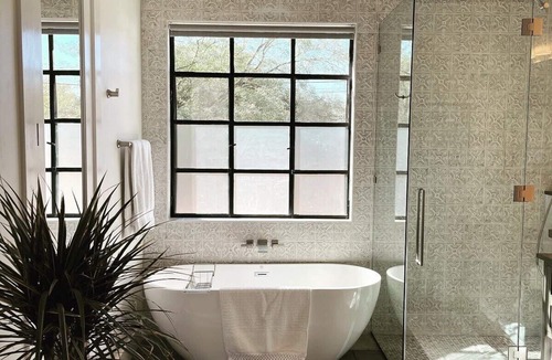 West University Hotel | Luxury king suite downtown w/lush garden terrace