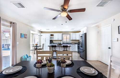 Phoenix House | Resort Style Backyard- Heated Pool, Putting Green, Outdoor TV and Pool Table.
