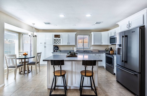Phoenix House | Resort Style Backyard- Heated Pool, Putting Green, Outdoor TV and Pool Table.