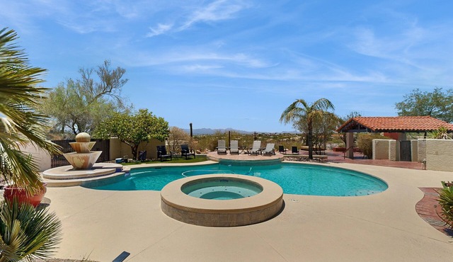 Dazzling retreat with city views, pool, hot tub, bocce ball court, & roof deck