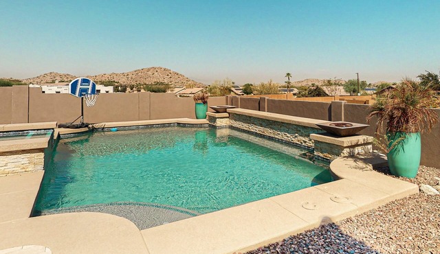 Luxury home with a pool, spa, fireplace, & private gas grill