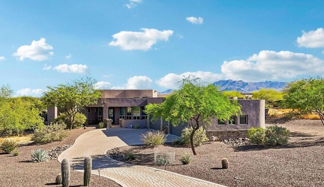 Modern desert contemporary 4 bedroom home with a large pool, spa, mountain views