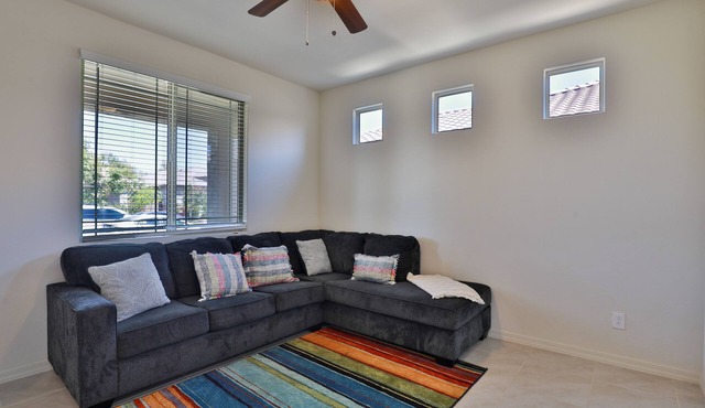 New 4 BR home with garage, pool, play area, splash pads, fenced backyard