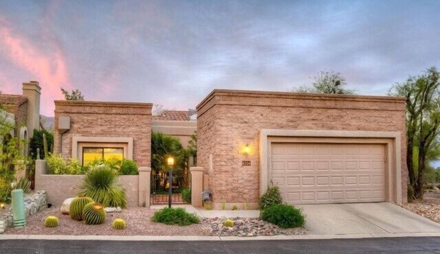 Ventana Canyon Golf Course at your fingertips from this stunning private home