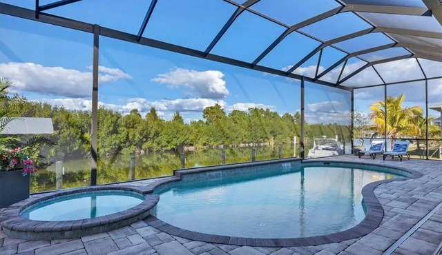 Waterfront private Resort style in South Gulf Cove, heated pool, spa & boat dock