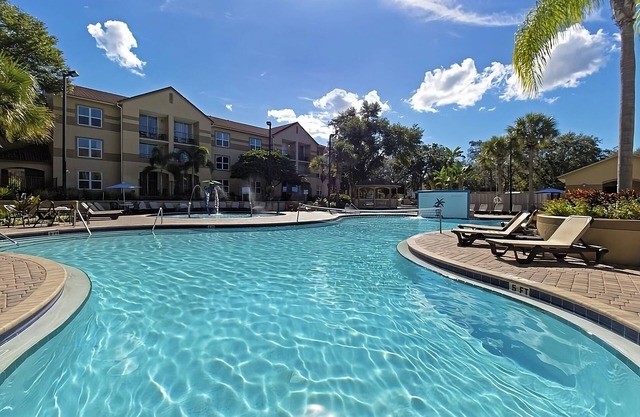 Family Group Getaway NEAR DISNEY! Three Comfy Suites, 4 Pools, Shuttle to Parks