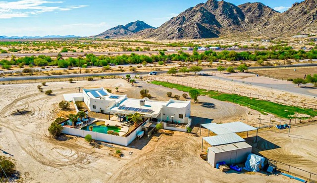Spacious desert charmer with a pool, covered patio, office, games, AC, and Wifi